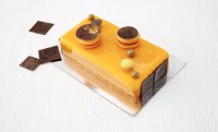 Kumquat- og pasjonsfrukt mousse, melkesjokolade nougatkrem, mandelbunn og hasselnøttcrisp